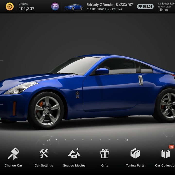 A blue Nissan Fairlady sits in the garage in Gran Turismo 7.