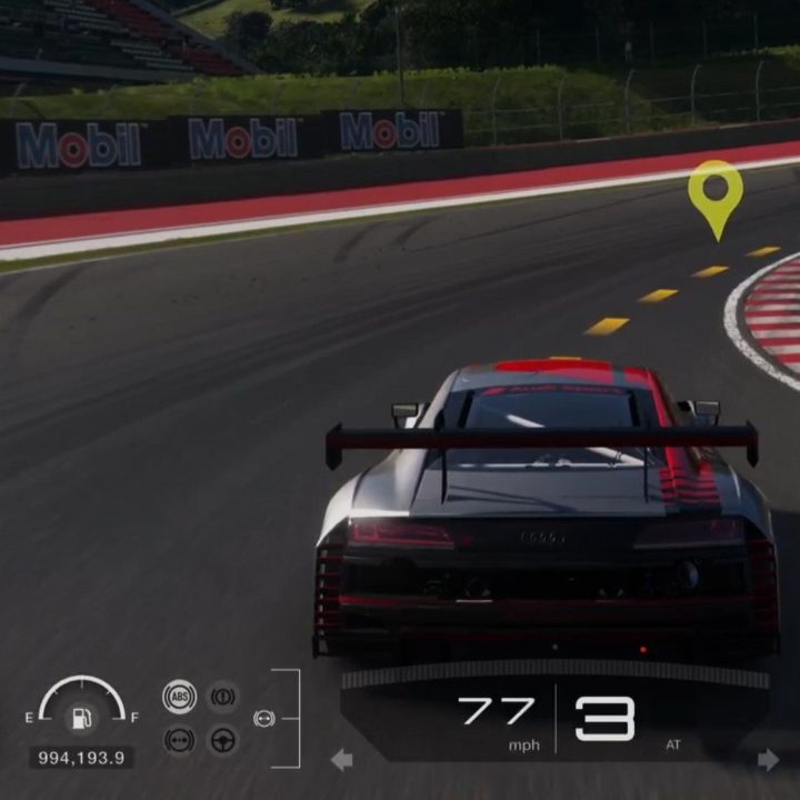 A racer takes the inside lane heading around a turn in Gran Turismo 7.