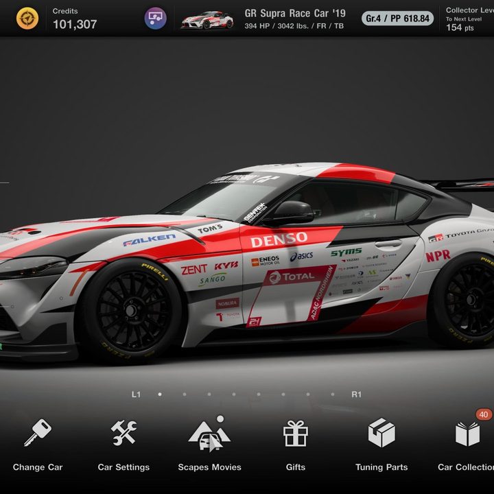 The GR Supra Race Car sits in the garage in Gran Turismo 7.