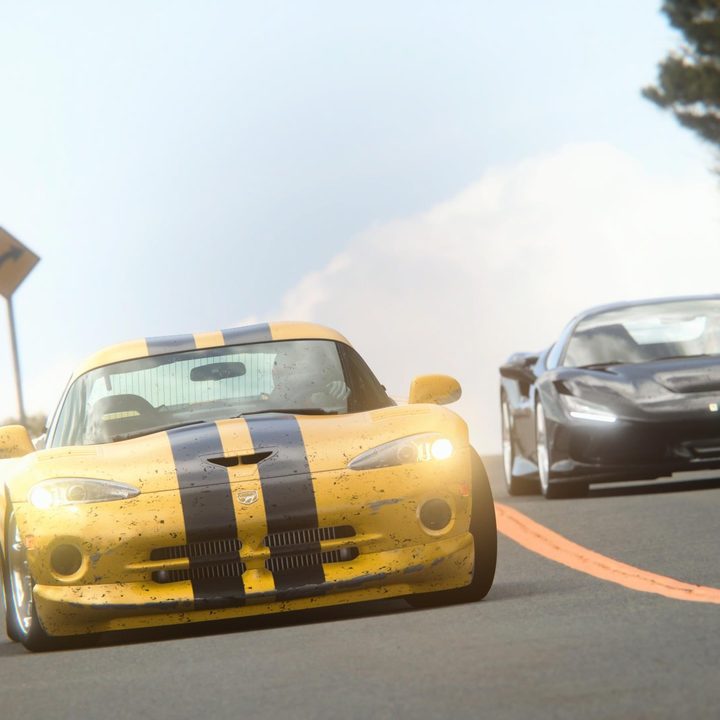 Two cars race around a bend in Gran Turismo 7.