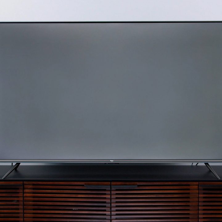 A FireTV being viewed straight on, the screen in gray.