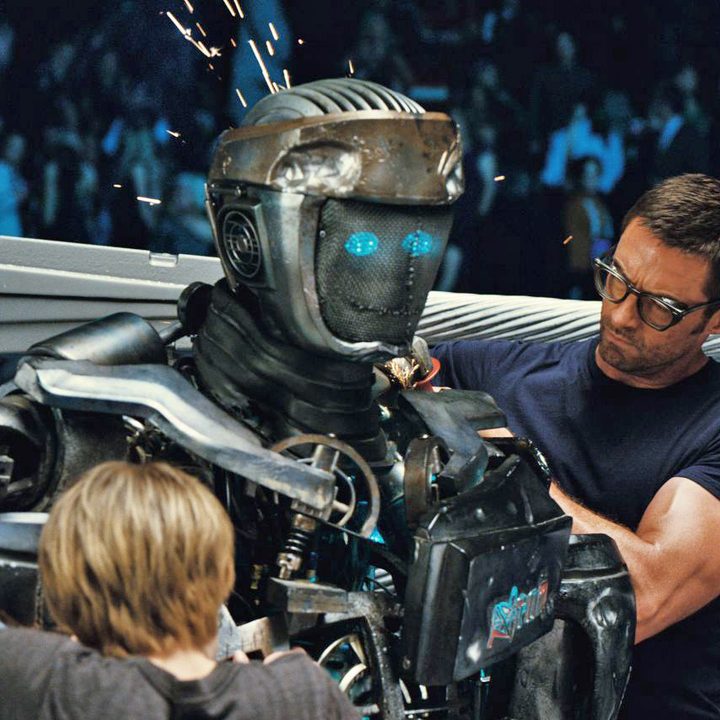 Hugh Jackman repairs a robot boxer in 2011's Real Steel.