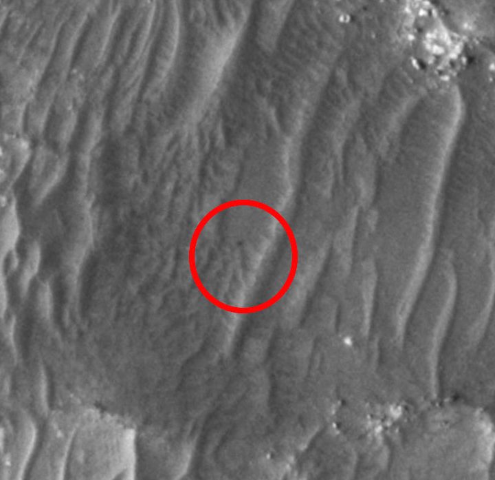NASA's Ingenuity helicopter captured by Mars Reconnaissance Orbiter.