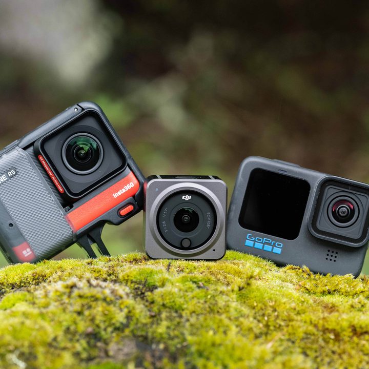 Insta360 One RS with DJI Action 2 and GoPro Hero 10 on a moss covered rock.