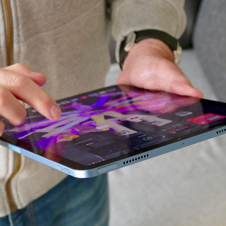 A person uses the Apple iPad Air 5.