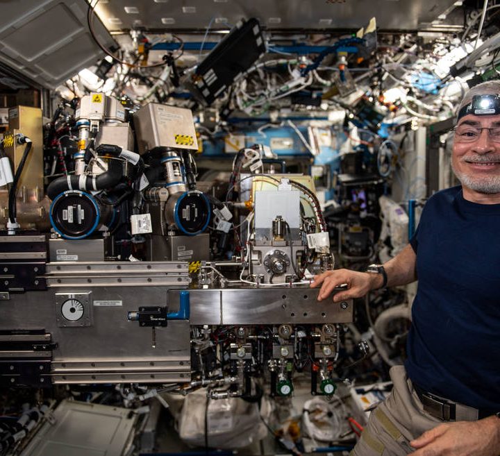 NASA astronaut and Expedition 66 Flight Engineer Mark Vande Hei poses for a photo on Feb. 10, 2022, while configuring the Combustion Integrated Rack in the U.S. Destiny laboratory module of the International Space Station to support a pair of fire safety experiments.