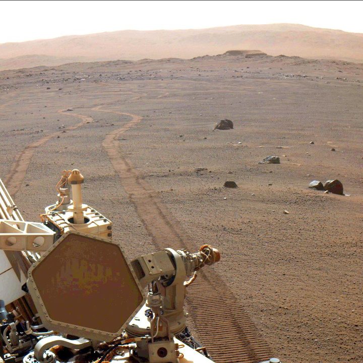 The wheel tracks of the Perseverance Mars rover.
