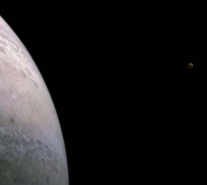 Zoomed in image showing Jupiter's moon Io (on the left) and Europa (on the right).