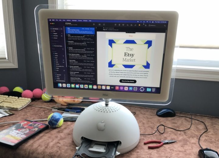 A modded Apple iMac G4 featuring an M1 chip on a desk in front of a window.