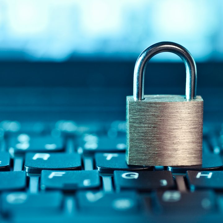 A physical lock placed on a keyboard to represent a locked keyboard.