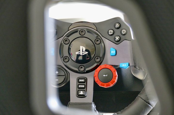 Logitech G29 controls and PlayStation logo.