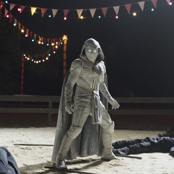 Moon Knight stands over a crowd of beaten criminals.