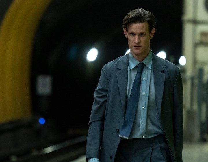 Matt Smith walks down a street in a scene from Morbius.