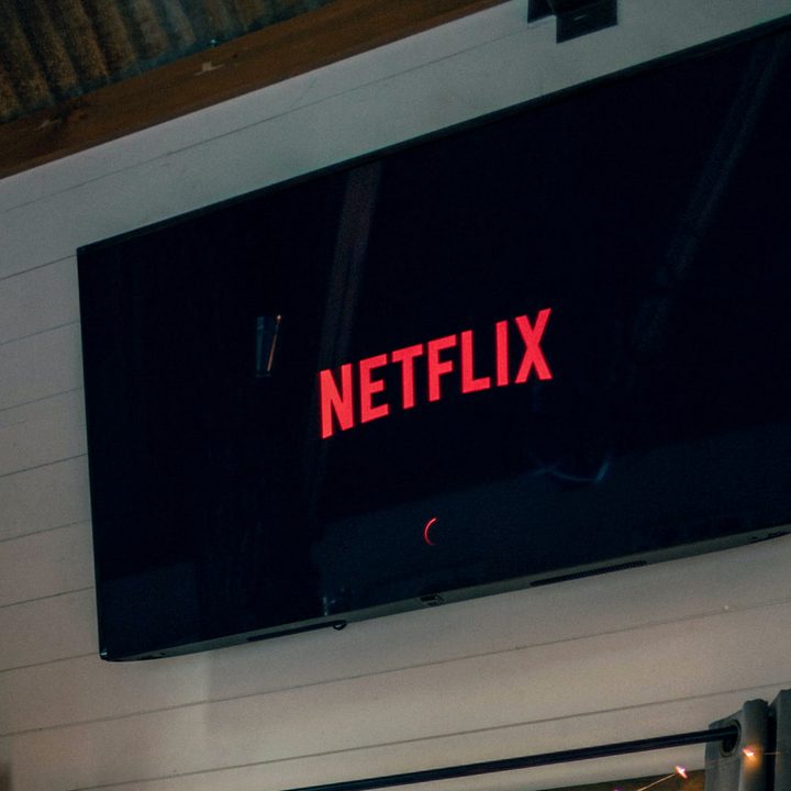 Netflix start screen on a wall-mounted TV.