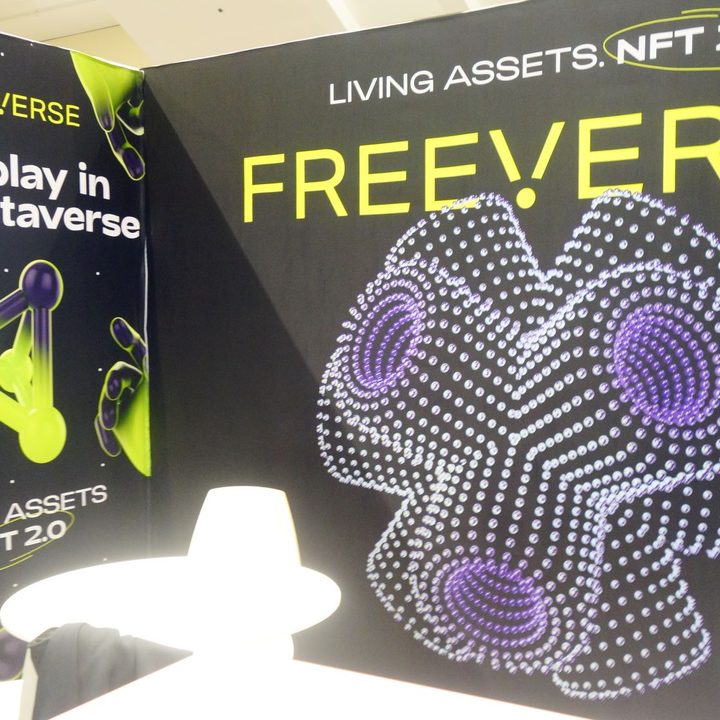A Game Developers Conference booth advertises NFT 2.0 tech.