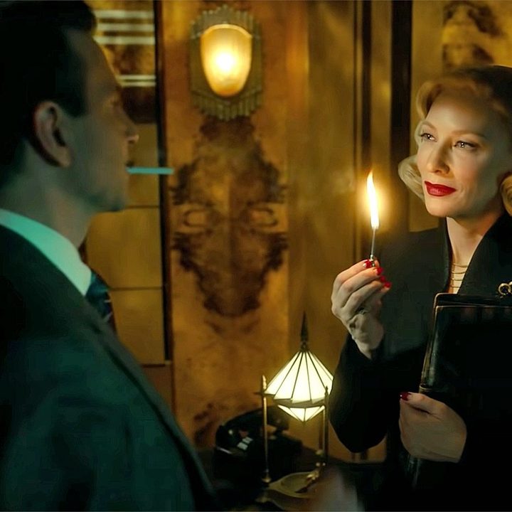 Lilith lights a match for Stan in Nightmare Alley.