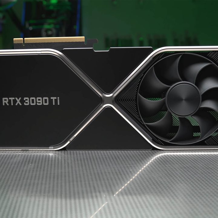A Nvidia RTX 3090 Ti sits on a silver table.