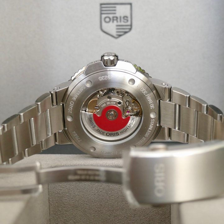 The case back of the Oris Aquis Date Upcycle watch.