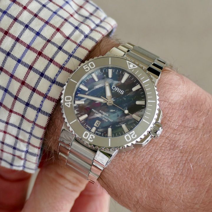 The Oris Aquis Date Upcycle watch on a wrist.