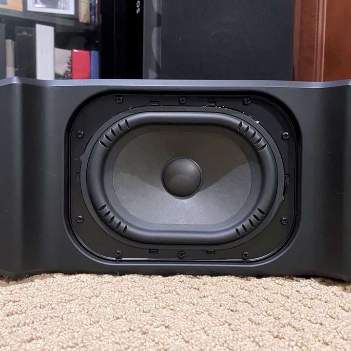 Bottom view of the Polk MagniFi Mini AX's subwoofer showing the oval driver.