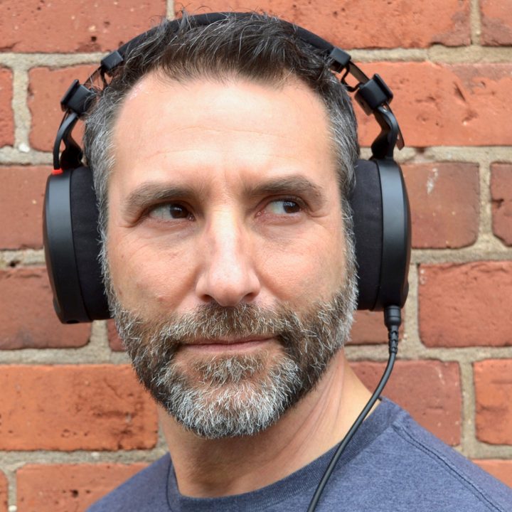 Front view of a man wearing the Rode NTH-100 headphones.
