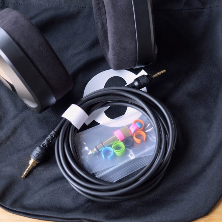 The Rode NTH-100 headphones come with an audio cable, a protective pouch, a 3/4-inch adapter, and colored cabled identifier rings.