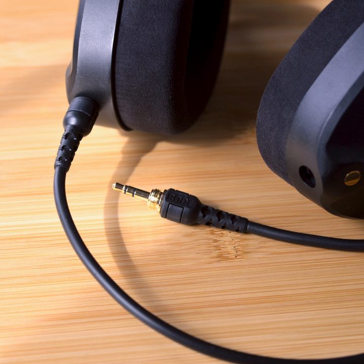 Close-up of the Rode NTH-100's earcup with audio cable attached.