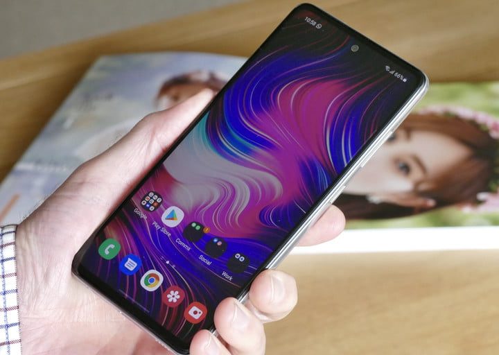 Samsung Galaxy A52 5G facing front in hand.