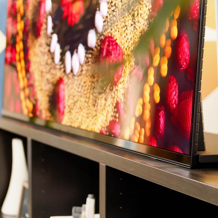 The Sony A95K TV's stand in the "traditional orientation."