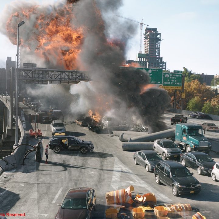 An explosion on a bridge in a scene from Spider-Man: No Way Home.