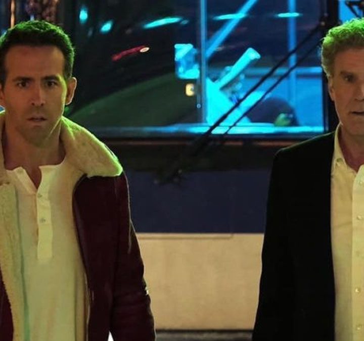 Ryan Reynolds and Will Ferrell in Spirited.