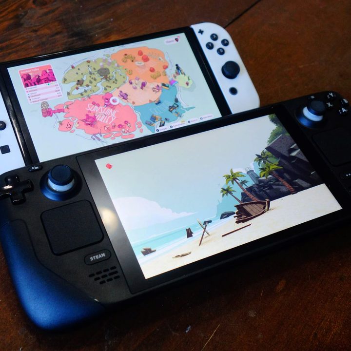 A Steam Deck sits next to a Switch OLED.