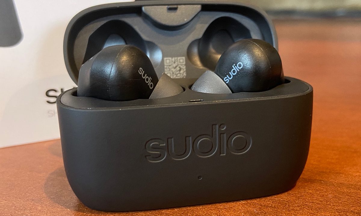 Sudio E2 wireless earbuds in their charging case.