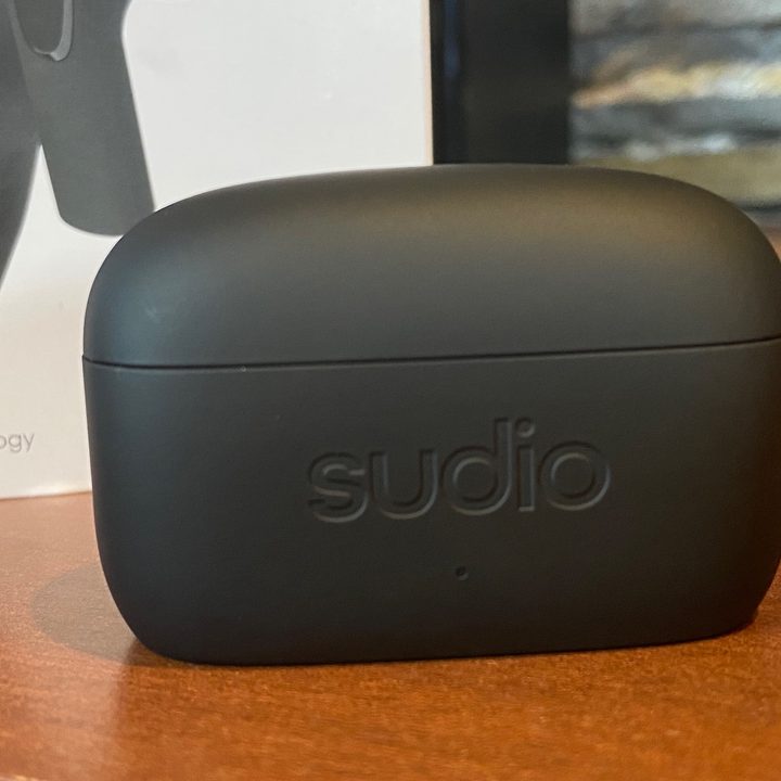 Sudio E2 wireless earbuds' charging case seen from the front..
