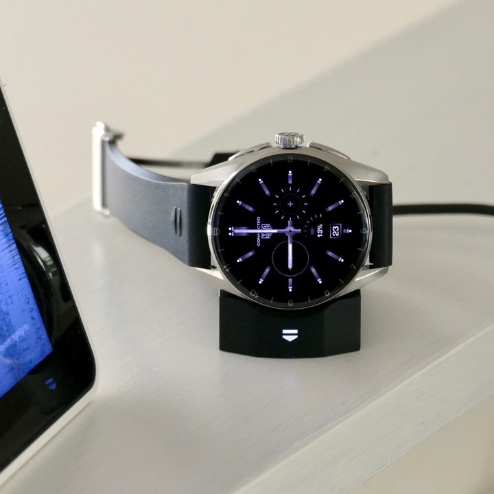 The Tag Heuer Connected Calibre E4 watch on its charging dock.