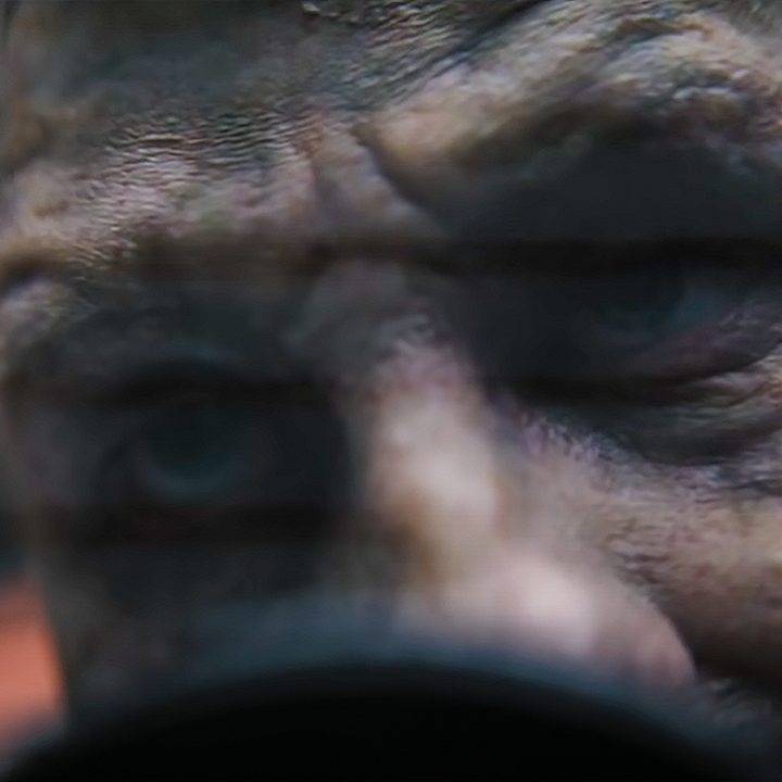 A close-up shot of Barry Keoghan's Joker in The Batman.