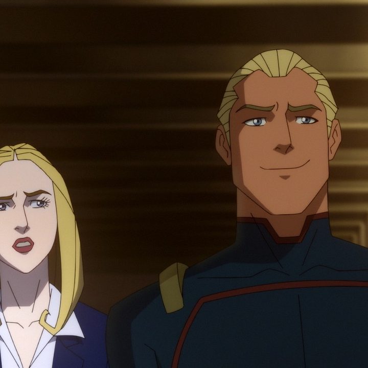 Homelander walks down a hallway with his handler in a scene from The Boys Presents: Diabolical.