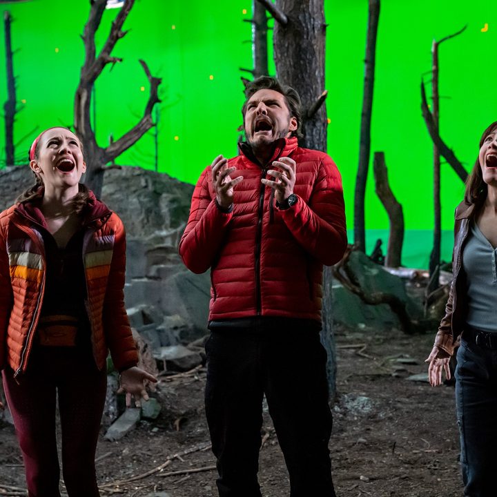 Iris Apatow, Pedro Pascal, and Leslie Mann scream on a movie set in a scene from The Bubble.