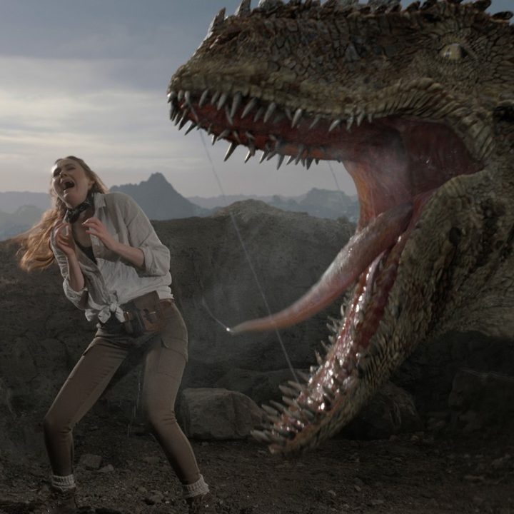 Karen Gillan screams as a digital dinosaur roars at her in a scene from The Bubble.