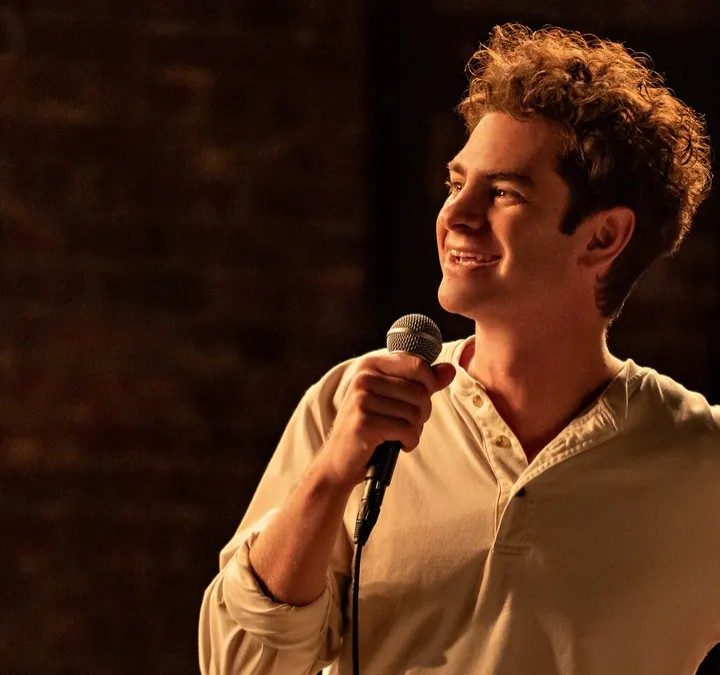 Andrew Garfield talks into a microphone in tick, tick...BOOM!