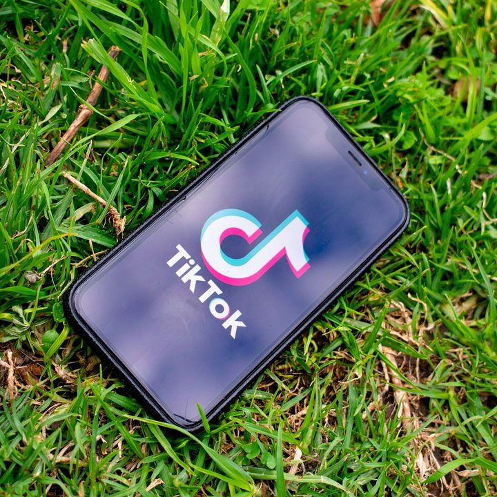 TikTok splash screen seen on a smartphone display.