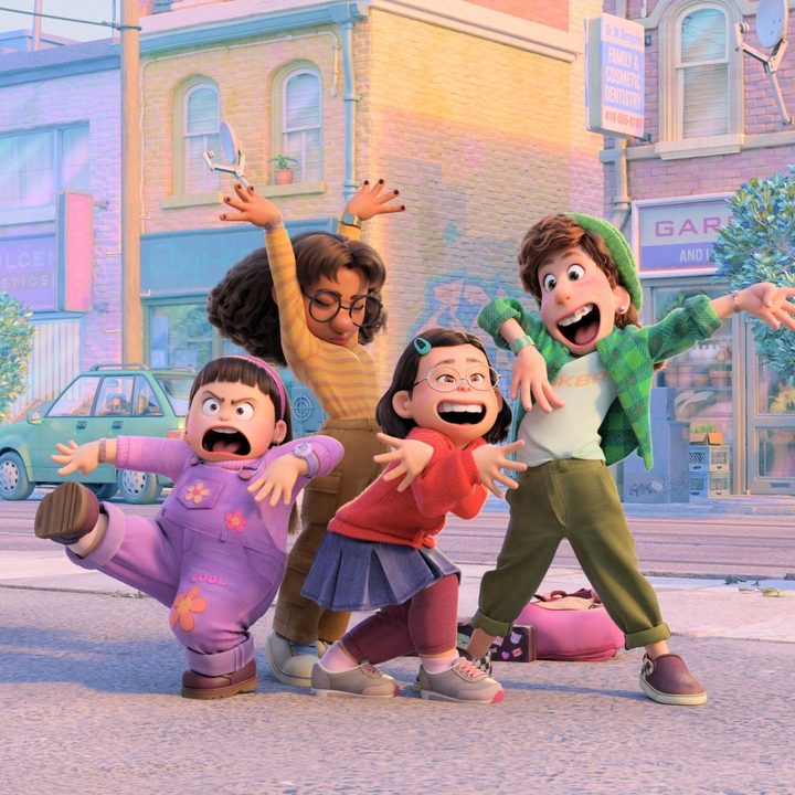 Mei and her friends pose on the street in a scene from Turning Red.