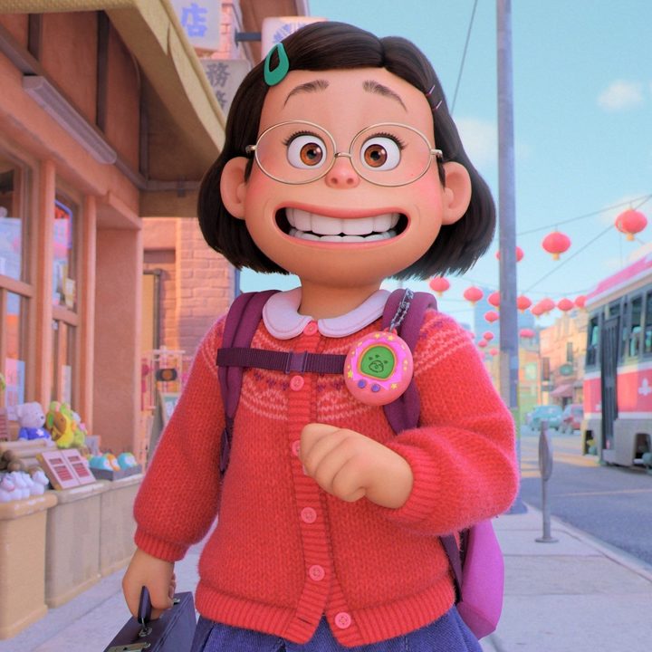 Mei walks down the street in a scene from Turning Red.