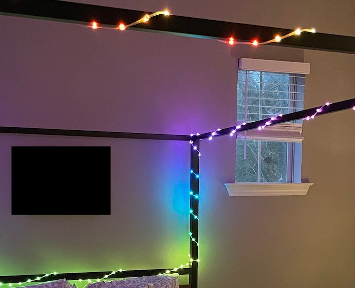 Twinkly Dots mounted on a bedframe.