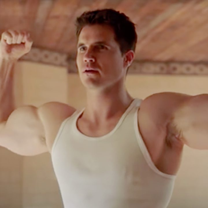 Nathan flexing his muscles, which have been digitally enhanced, in a scene from Upload.