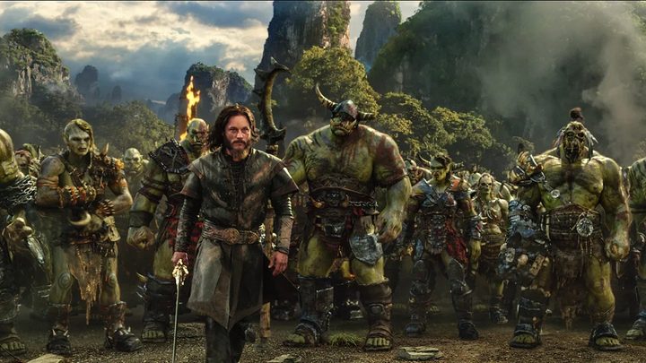 A man and several beasts prepare for war in Warcraft.