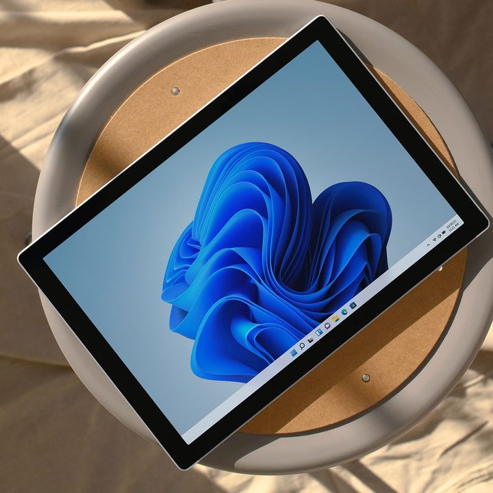Windows 11 device sitting on a stool.