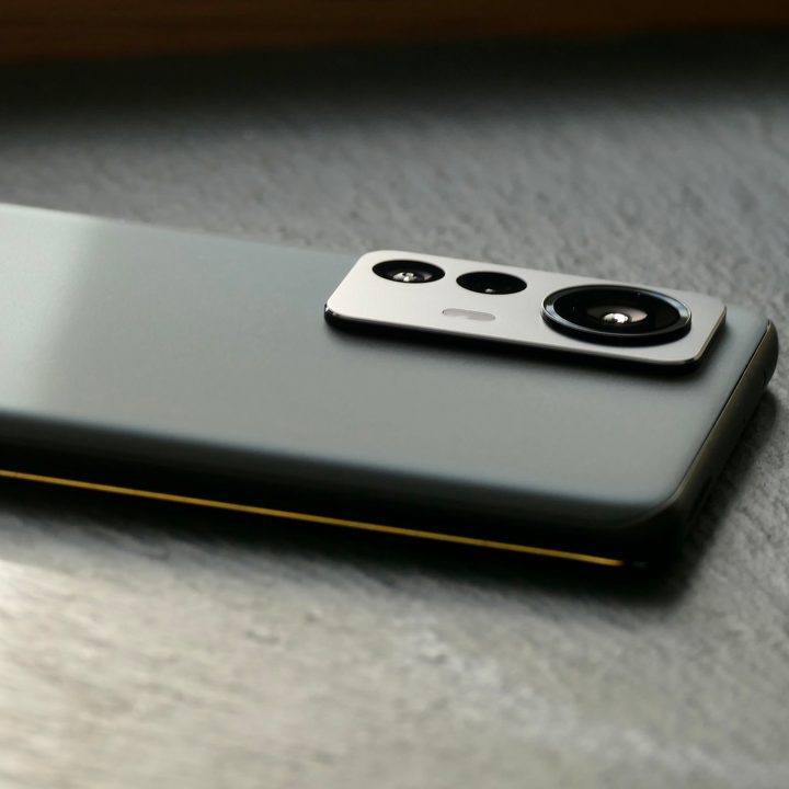 The Xiaomi 12 Pro lays on a flat surface with the camera module visible.