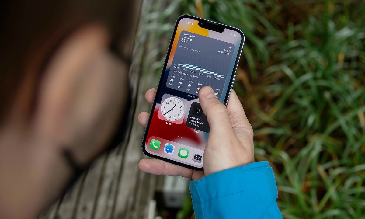 A person using the Apple iPhone 13 Pro.