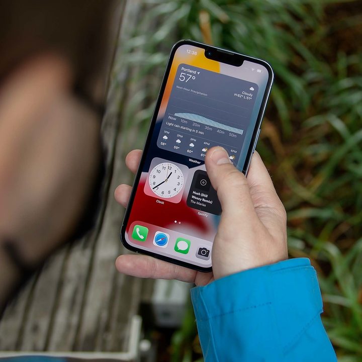 A person using the Apple iPhone 13 Pro.